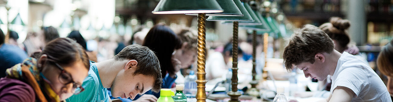 Students studying in great reading hall